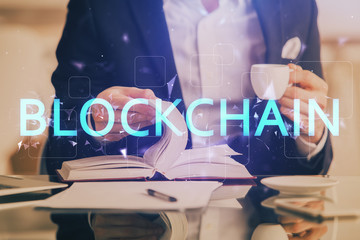 Man's hands working with notes background. Cryptocurrency and finance concept.