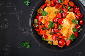 Grilled chicken fillets and sweet pepper on grill iron pan. Top view, copy space