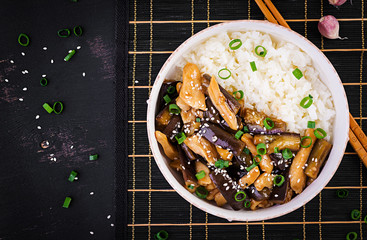 Stir fry with chicken, eggplant and boiled rice - Chinese food. Top view