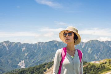 Naklejka premium Asian mountain climbing woman