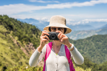 Asian climbing woman take pictures