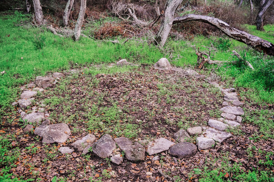 A rock circle discovery in a secluded wooded area in the hills of Monterey, California, presumably an Indian (Native American) burial grave site.