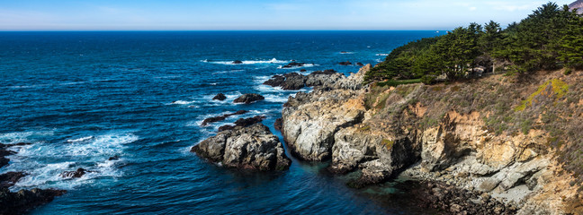 The rocky coast of central California taken from the cliffs of scenic Highway 1, along the Pacific Coast of the Monterey Bay in Big Sur. California travel.