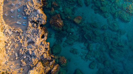 Secret Beach on Rocky Shore and Blue Waters, Greek Island, Drone View