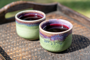 Welcome drink with roselle juice at the hotel in Koh Phangan island , Thailand. Two drinks in a ceramic cup on a tray