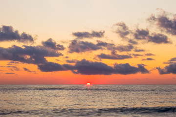 Cloudscape over the sea, colorful sea beach sunrise. Sea in sunrise nature landscape.