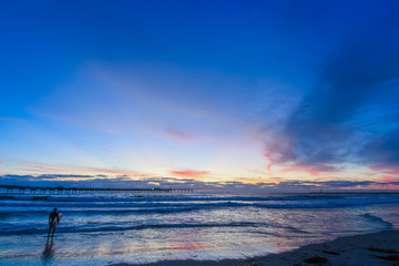 Silhouette of a Surfer at Sunset at Ocean Beach in San Diego California, USA