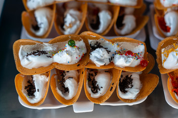 Sweet Thai crepe, or Kanom Bueang in Thai,is an ancient Thai dessert. It is usually filled with coconut cream, followed by sweet or salty toppings.