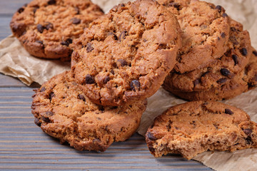 Chocolate oatmeal chip cookies on the rustic wooden table.