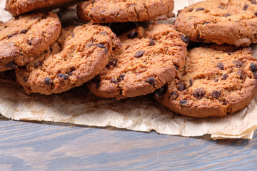 Chocolate oatmeal chip cookies on the rustic wooden table.