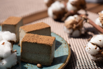 Raw vegan cake tiramisu on the plate, with coffee beans