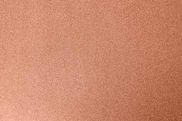 Copper festive background, close-up. Copy space for text. Horizontal. Celebration, holidays, sales, fashion concept, harvesting for mock up.