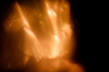 Lens Flare. Light over black background. Easy to add overlay or screen filter over photos. Abstract sun burst with digital lens flare background. Gleams rounded and hexagonal shapes, rainbow halo.