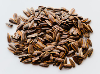 Abstract close up sunflower seeds on the white isolated background and wallpaper