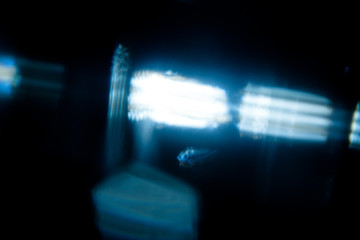 Lens Flare. Light over black background. Easy to add overlay or screen filter over photos. Abstract...