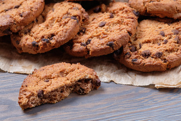 Chocolate oatmeal chip cookies on the rustic wooden table.
