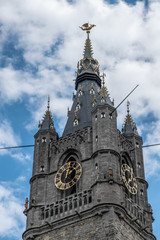 Gent, Flanders, Belgium -  June 21, 2019: Highest section of Belfry clock tower with Gulden Draak...