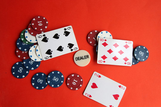 poker cards, pocker chips, money, pocker dice on red background. gambling, board games