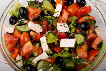 Fresh Greek salad in a glass bowl