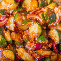 Oi Muchim Korean spicy cucumber salad close-up, top view.