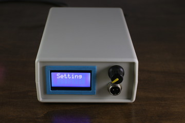 Electronic device with LCD, potentiometer for adjustment and connector