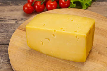 Hard yellow tasty cheese brick