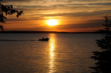 Fototapeta na wymiar Sunset over water in Saskatchewan, Canada