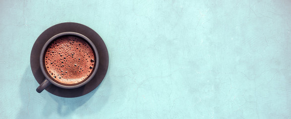 Black cup of coffee on teal background 3D Rendering