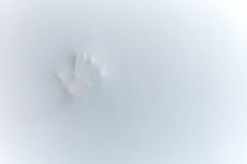 man touching the glass of shower cabinet. copy space.tissue imprint. the impression of a hand. handprint. UFO, mystery concept. white and black photo