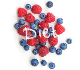 Mix berries isolated on white background. Ripe raspberry and blueberries.