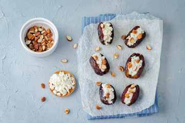 Almond and goat cheese stuffed dates with glasses of wine