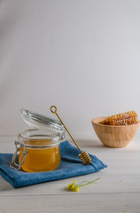 fresh honey and honeyons on a white background with copy space