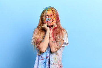 excited girl touching her chin with fists dreaming about something, girl falling in love. positive emotion and feeling