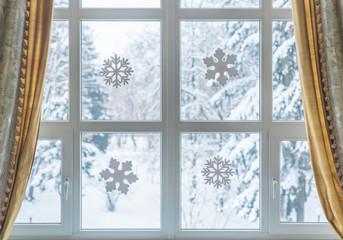 Window with paper snowflakes on glass
