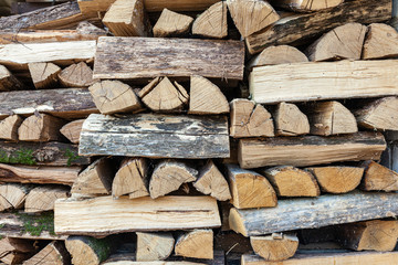 Background of dry chopped wood folded for the fireplace.
