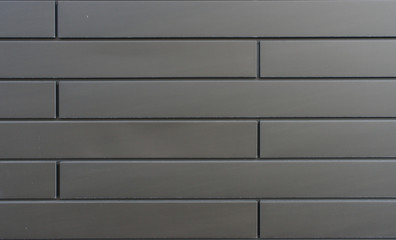 Texture of a metal wall with brickwork design