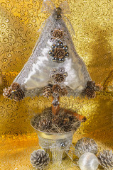 handmade Christmas tree, cushion type adorned with stonework, bow and lace with golden and silver tones, for table or home decoration
