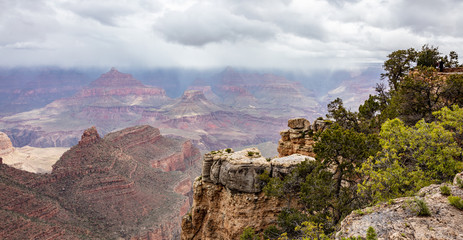 Fototapeta na wymiar Grand Canyon, Arizona, USA. Overlook of the red rocks, cloudy sky background