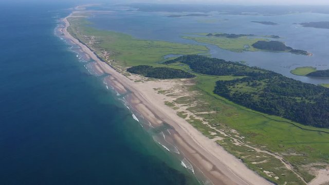 The nutrient-rich waters of the Atlantic Ocean bathe a scenic beach on Cape Cod, Massachusetts. This beautiful area of New England, not too far from Boston, is a popular summer vacation destination.
