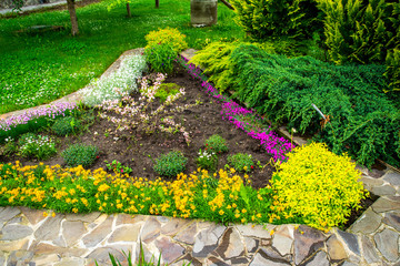 gravel and stones in the decoration of flower beds in landscape design