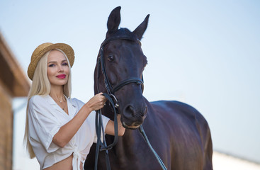 Obraz premium Woman and horse. Close up