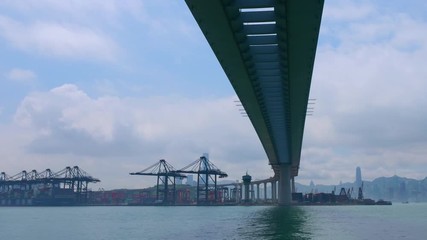 Time lapse of industrial port with containers ship in the harbor at Hong Kong city