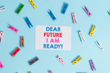 Handwriting text writing Dear Future I Am Ready. Conceptual photo suitable state for action or situation being fully prepared Colored clothespin rectangle shaped reminder paper light blue background