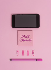 Text sign showing Sales Training. Business photo showcasing Action Selling Market Overview Personal Development Colored blank sticky note clips smartphone pen trendy pastel background