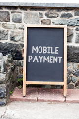 Handwriting text writing Mobile Payment. Conceptual photo Cashless Payment made through portable electronic devices Empty black board with copy space for advertising. Blank dark board