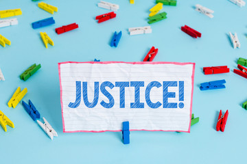 Conceptual hand writing showing Justice. Concept meaning impartial adjustment of conflicting claims or assignments