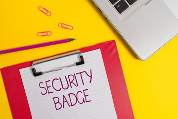 Text sign showing Security Badge. Business photo text Credential used to gain accessed on the controlled area Slim metallic laptop clipboard paper sheet clips pencil colored background