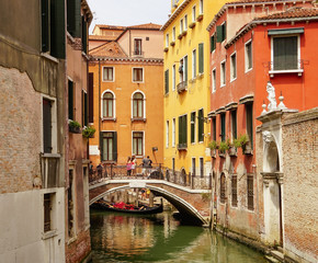Fototapeta na wymiar VENICE, ITALY - JULY,5: Nice day in the center of Venice, boats, buildings, bridges and channels
