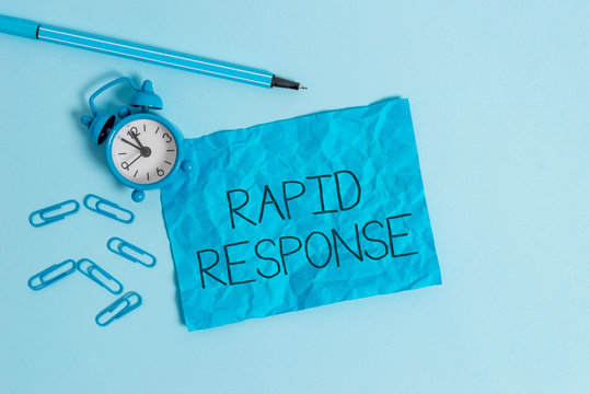 Word writing text Rapid Response. Business photo showcasing Medical emergency team Quick assistance during disaster Metal alarm clock blank crushed sheet marker clips sky colored background