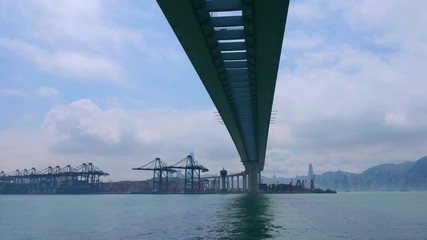 Time lapse of industrial port with containers ship in the harbor at Hong Kong city